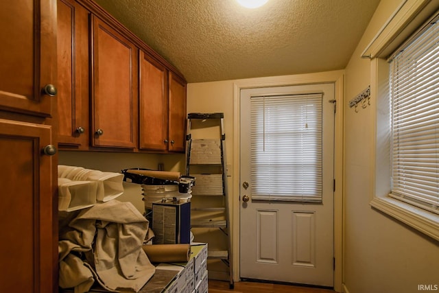 laundry room featuring a textured ceiling