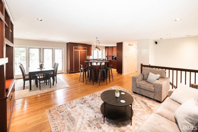 living room with light hardwood / wood-style floors