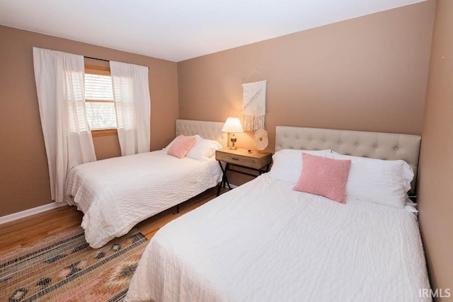 bedroom with hardwood / wood-style floors