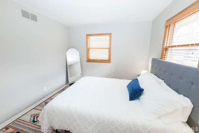 bedroom featuring multiple windows