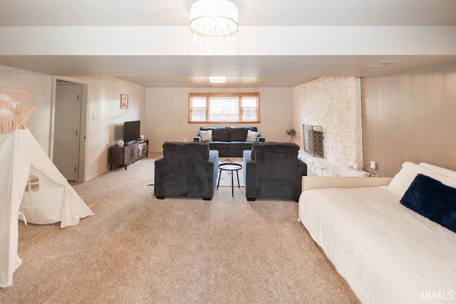 carpeted bedroom with a fireplace