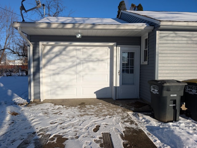 view of snow covered garage