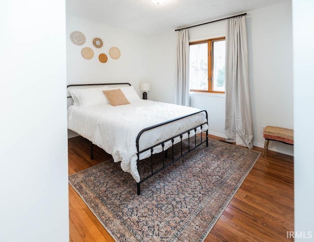 bedroom featuring hardwood / wood-style flooring