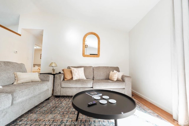 living room featuring hardwood / wood-style floors and vaulted ceiling