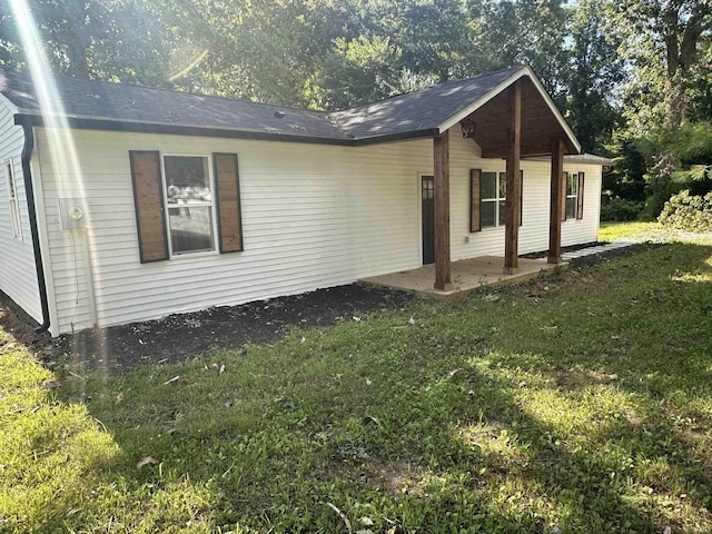 exterior space featuring a lawn and a patio