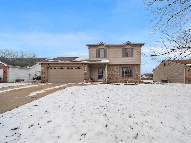 front of property with central AC and a garage