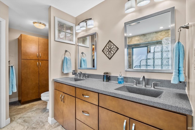 bathroom featuring toilet and vanity