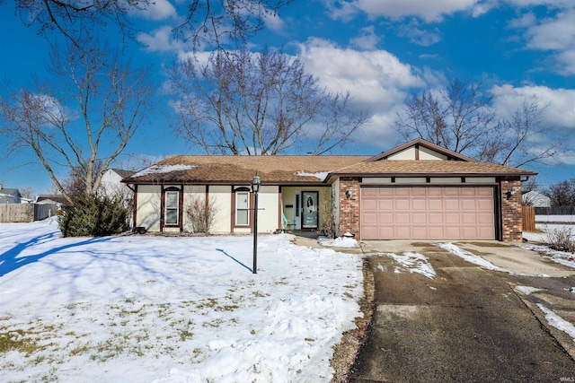 ranch-style house featuring a garage