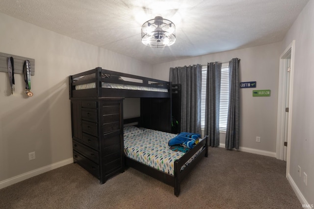 carpeted bedroom with a textured ceiling