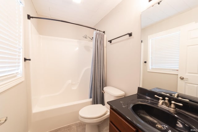 full bathroom featuring vanity, shower / bath combination with curtain, and toilet