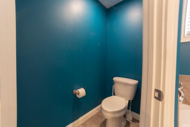 bathroom with tile patterned floors and toilet