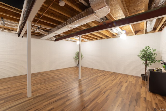 basement featuring hardwood / wood-style floors