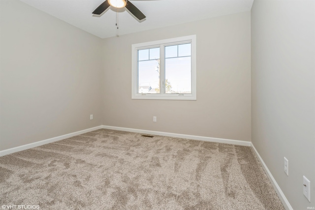 carpeted empty room with ceiling fan