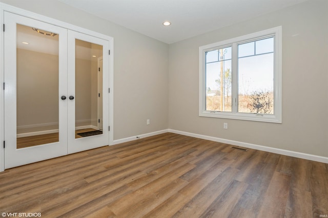 interior space with french doors, a closet, and wood-type flooring