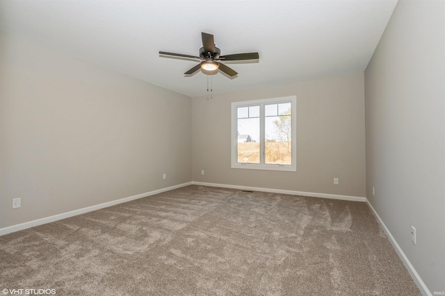 carpeted empty room with ceiling fan