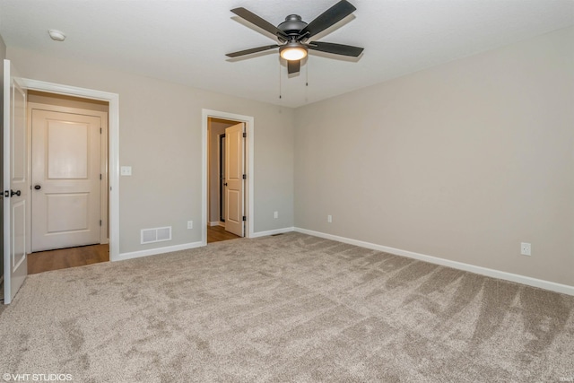 unfurnished bedroom with ceiling fan and light carpet