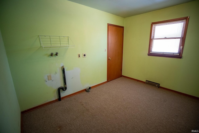 clothes washing area featuring light carpet, washer hookup, and hookup for an electric dryer