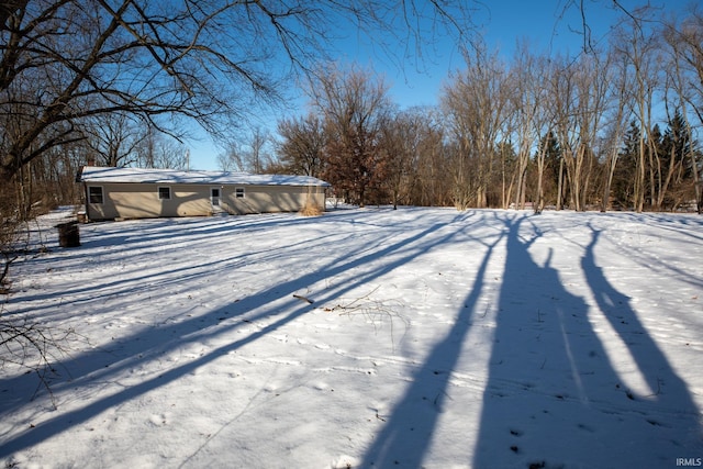 view of yard layered in snow