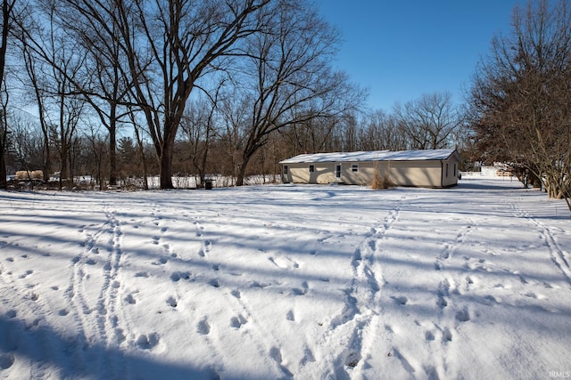 view of yard covered in snow