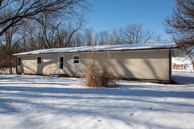 view of snow covered house