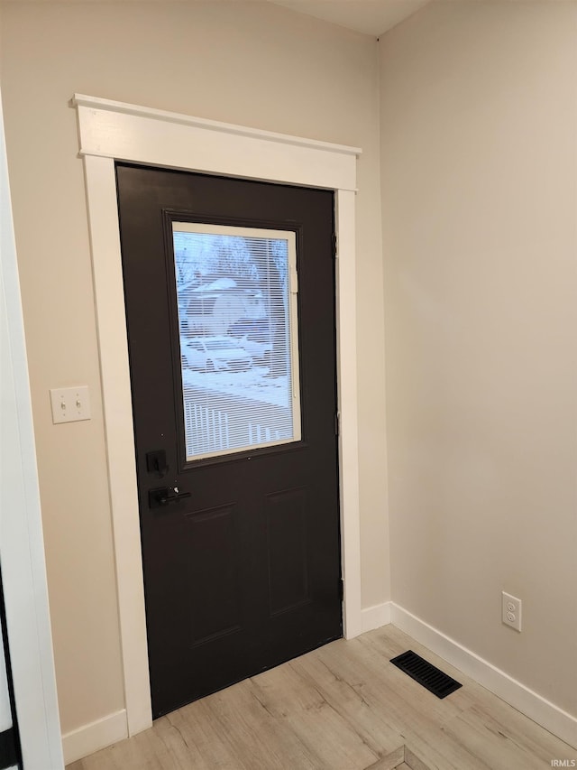 doorway featuring light wood-type flooring