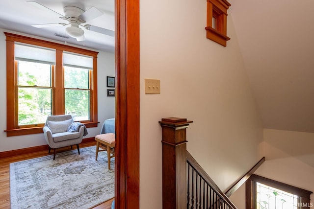 living area featuring ceiling fan and wood-type flooring