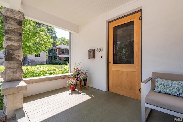 entrance to property featuring covered porch