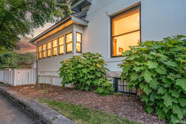 view of property exterior at dusk