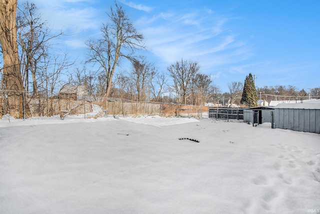 view of yard layered in snow