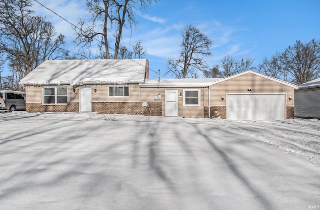 single story home with a garage