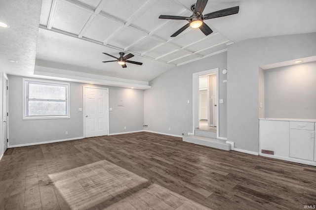 unfurnished living room featuring ceiling fan and dark hardwood / wood-style flooring