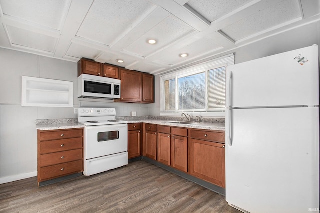 kitchen featuring white appliances, dark hardwood / wood-style flooring, beamed ceiling, sink, and coffered ceiling