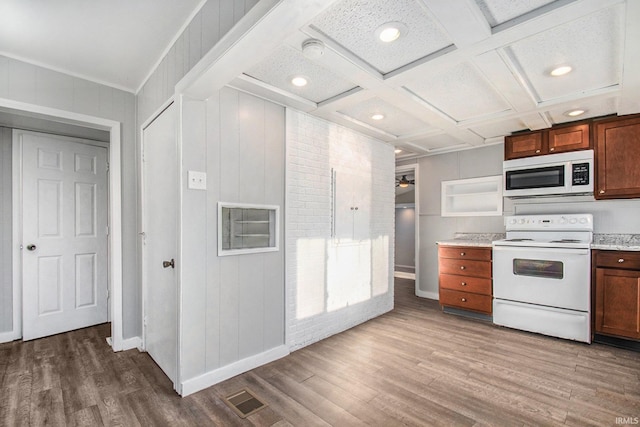 kitchen featuring beamed ceiling, white appliances, coffered ceiling, and hardwood / wood-style floors