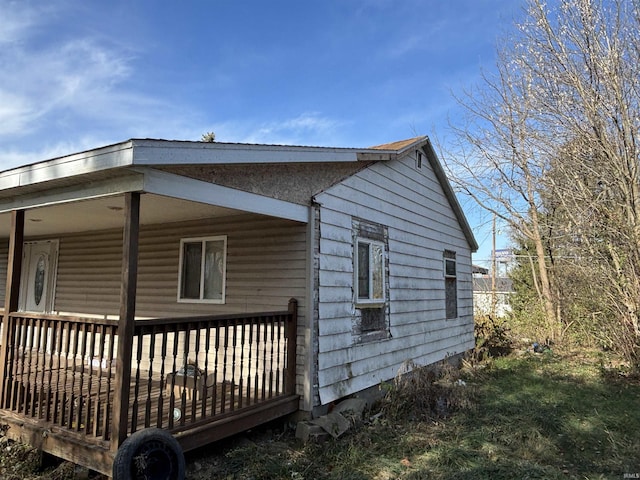 view of side of property with a deck