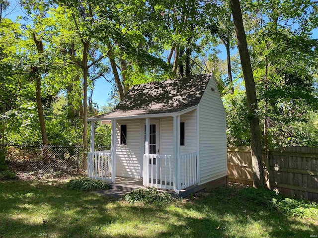 view of outbuilding with a yard