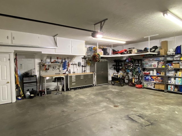 garage featuring a workshop area and a garage door opener