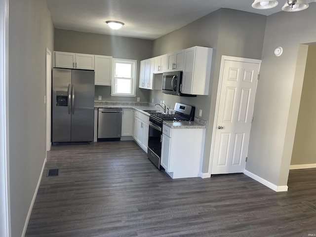 kitchen with sink, white cabinets, and stainless steel appliances