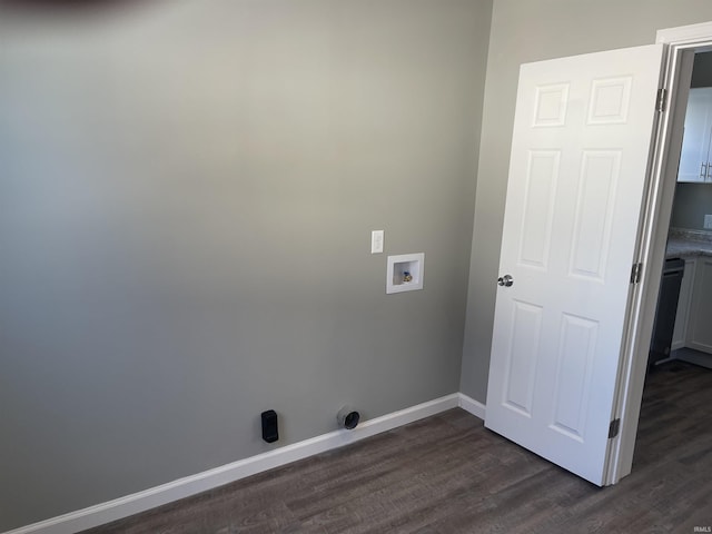 laundry area featuring dark wood-type flooring, washer hookup, and cabinets