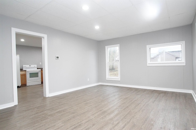 spare room featuring light hardwood / wood-style floors