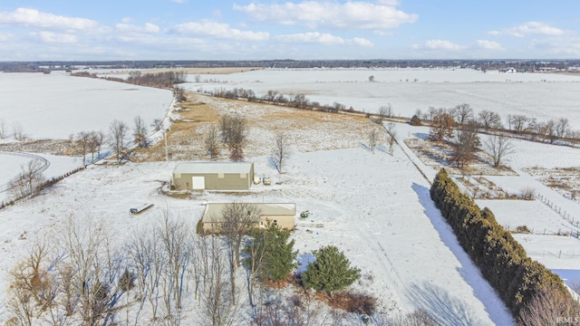 snowy aerial view featuring a rural view