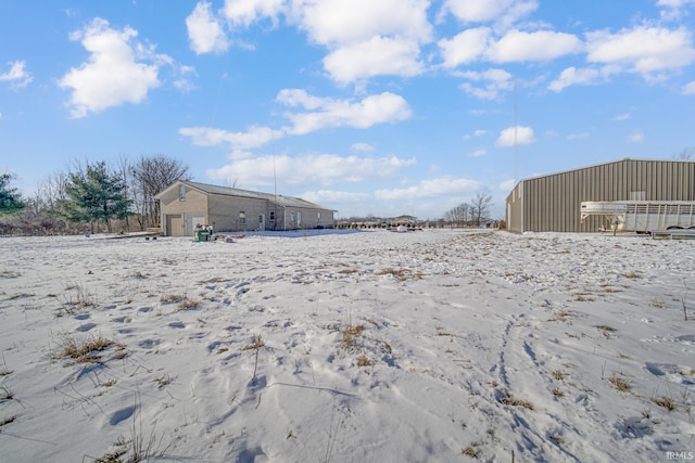 view of yard covered in snow