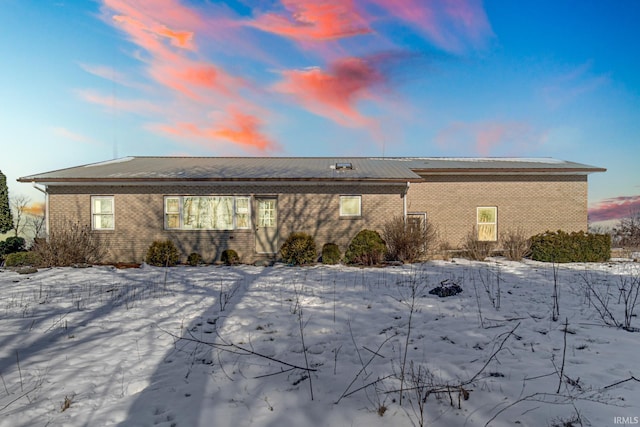 view of snow covered property