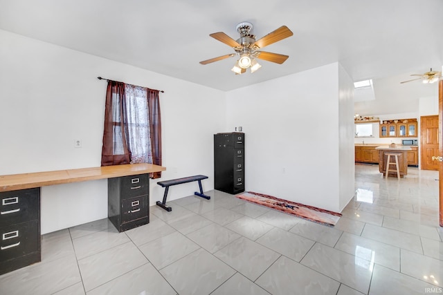 tiled office with ceiling fan and built in desk