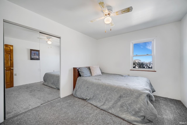 carpeted bedroom featuring ceiling fan and a closet