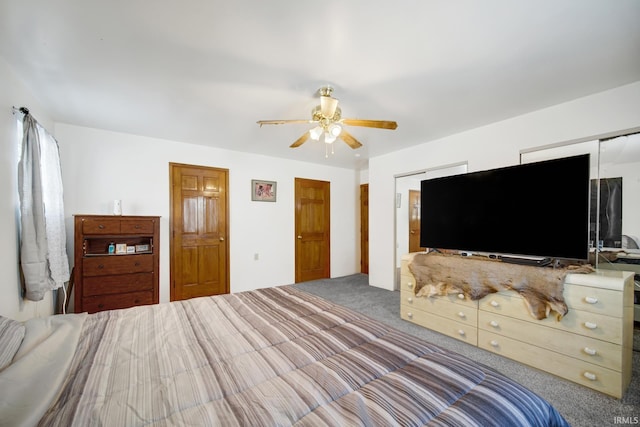 unfurnished bedroom featuring ceiling fan and carpet floors