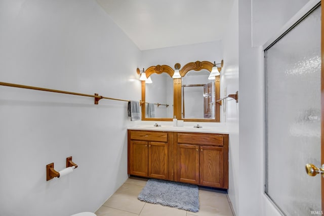 bathroom featuring an enclosed shower, vanity, and tile patterned flooring