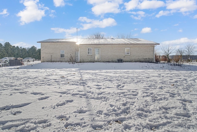 view of snow covered house