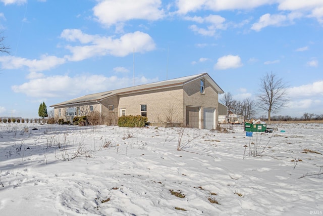 view of snow covered property