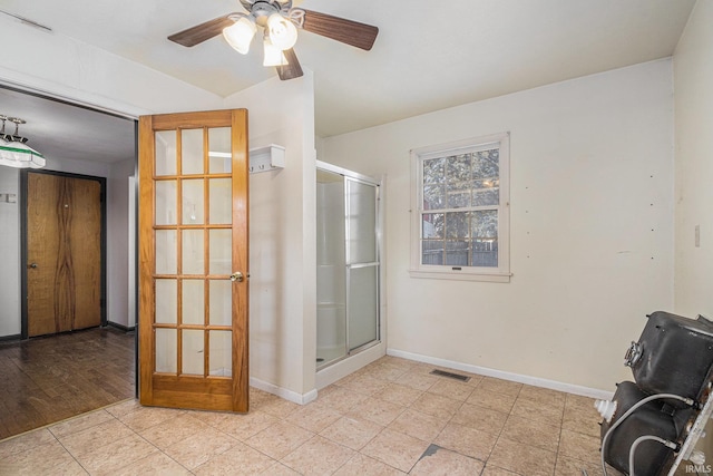 bathroom with ceiling fan and french doors