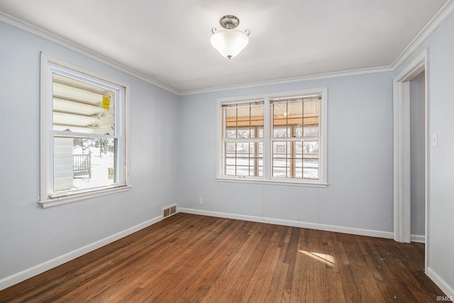 unfurnished room featuring dark wood-type flooring, crown molding, and plenty of natural light